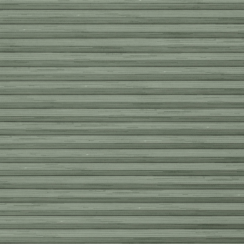 Pale-green horizontal metal rolling shutter with narrow ribbed slats dominates frame; fully closed, slightly weathered; exterior storefront or garage faÃ§ade under even daylight.