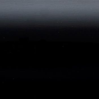 Horizontal dark gradient panel (object) showing faint horizontal banding and tiny light specks, appearing smooth and slightly reflective (action); occupying the entire frame in an abstract, low-light scene (context).