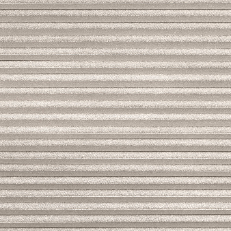 Beige pleated cellular shade, textured fabric with narrow horizontal folds, fully lowered and closed; filtering diffuse light into a neutral, softly lit interior space with no visible view.