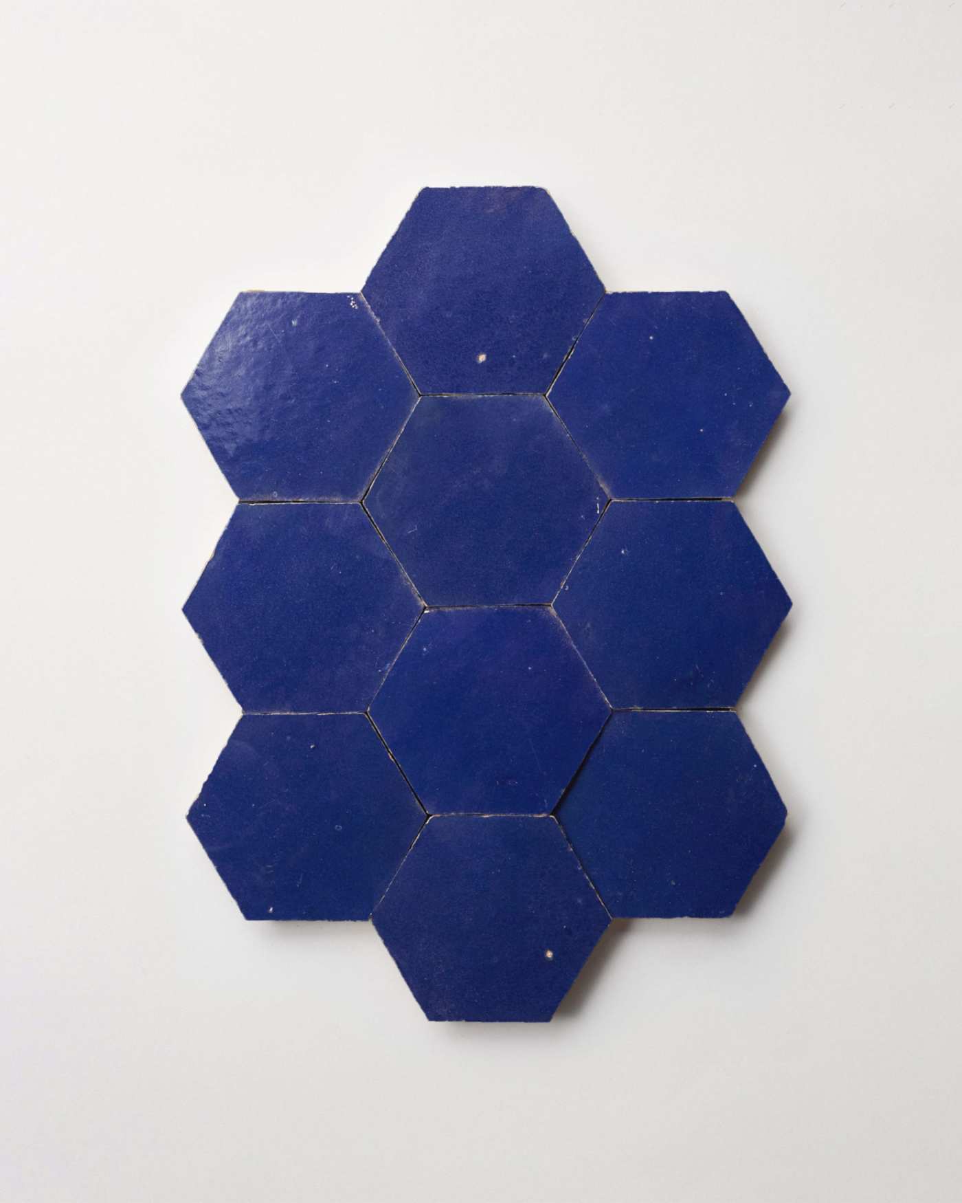 blue hexagon tiles arranged on a white background.