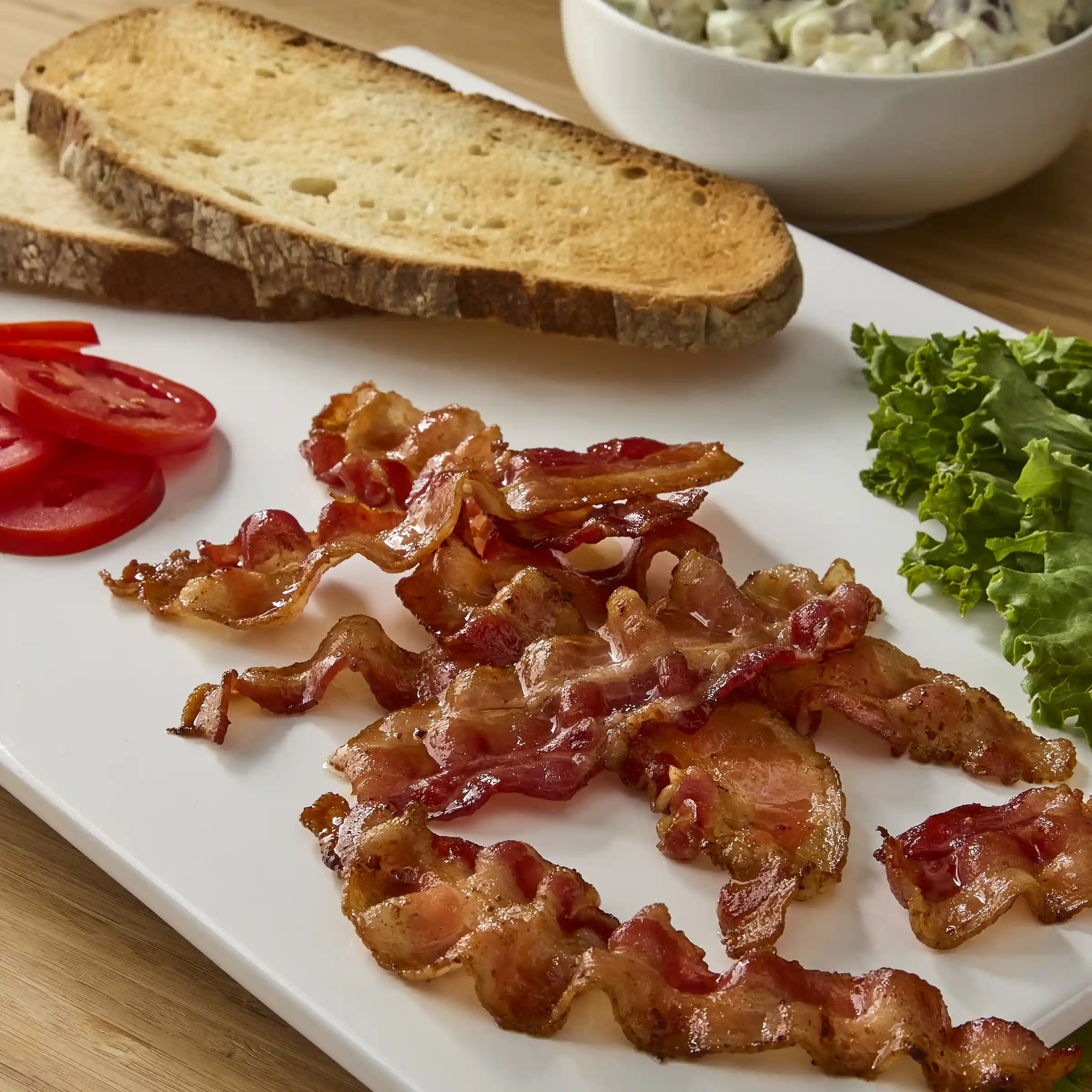 Wright® Brand Natural Hickory Smoked Thick Sliced Bulk Bacon 10/14 https://images.salsify.com/image/upload/s--wK0-EWGD--/q_25/yel9cqh8gbhgmwq1o8cy.webp