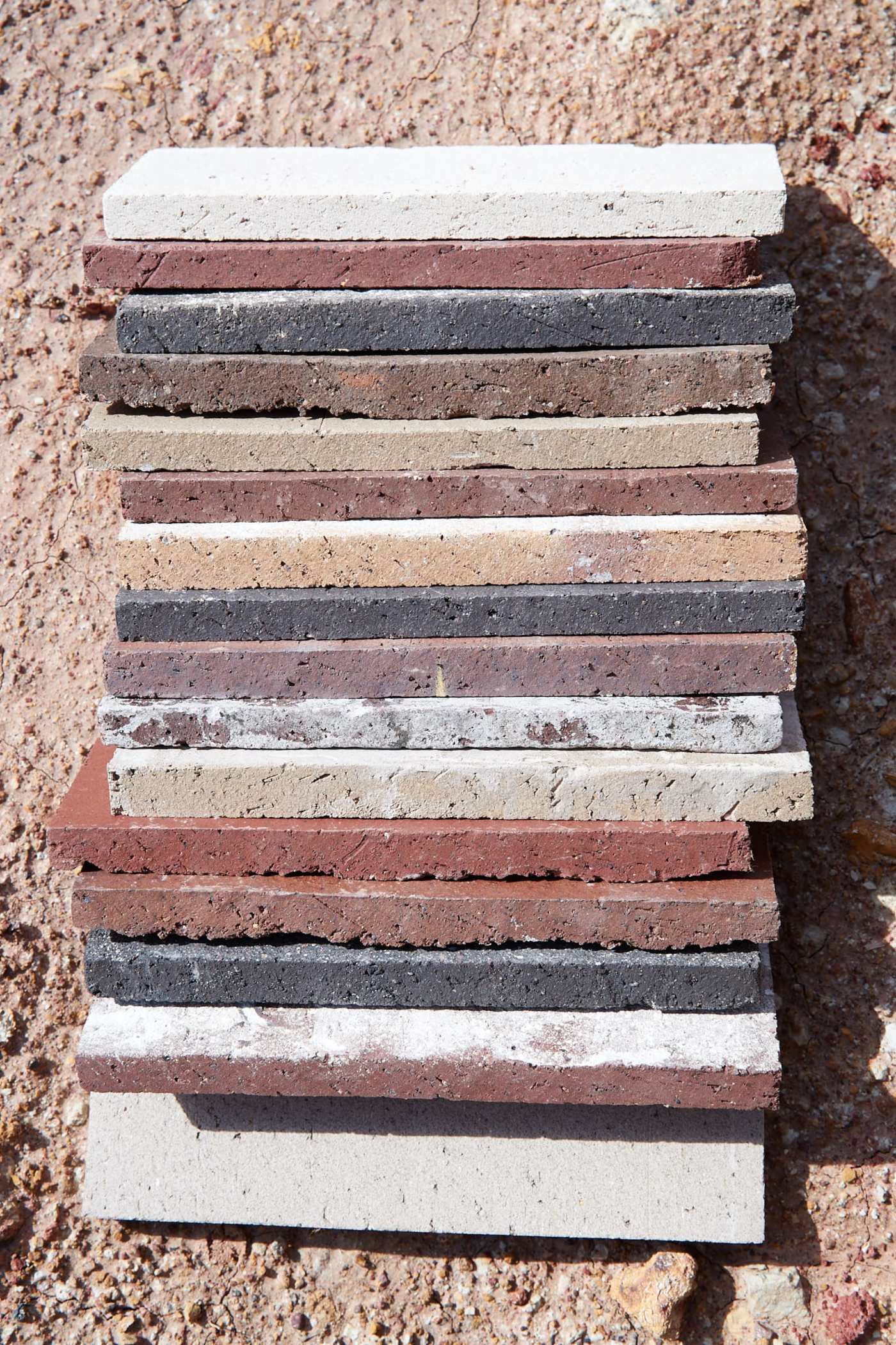 a pile of various colored bricks on the ground.