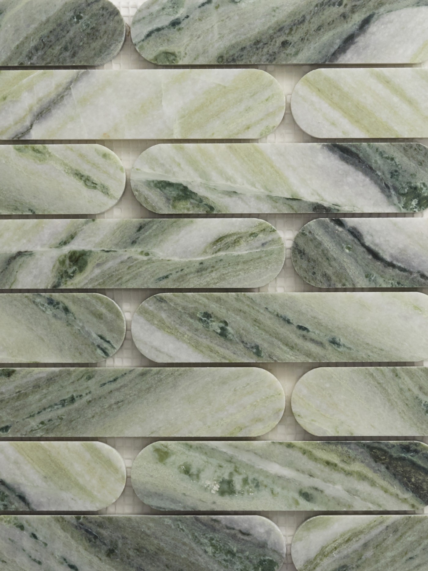 a close up of a green marble tile.