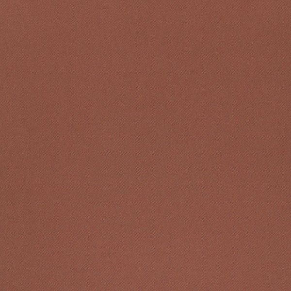 Rust-colored diagonal herringbone fabric occupying the frame, displaying fine woven texture and subtle diagonal striping; close-up, evenly lit surface with no visible objects or room context.