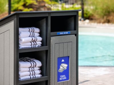 recycled plastic towel collection bin for pools and recreation facilities outside at a private community pool