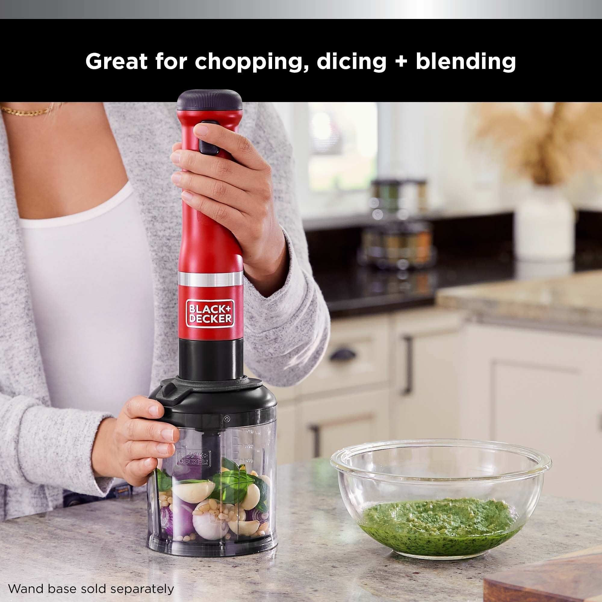 Talent using the liquid port to easily add liquid into the bowl while using the BLACK+DECKER kitchen wand™ food chopper attachment