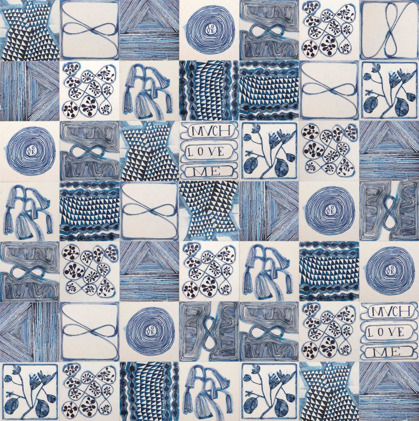 a blue and white tile with a variety of items on it.