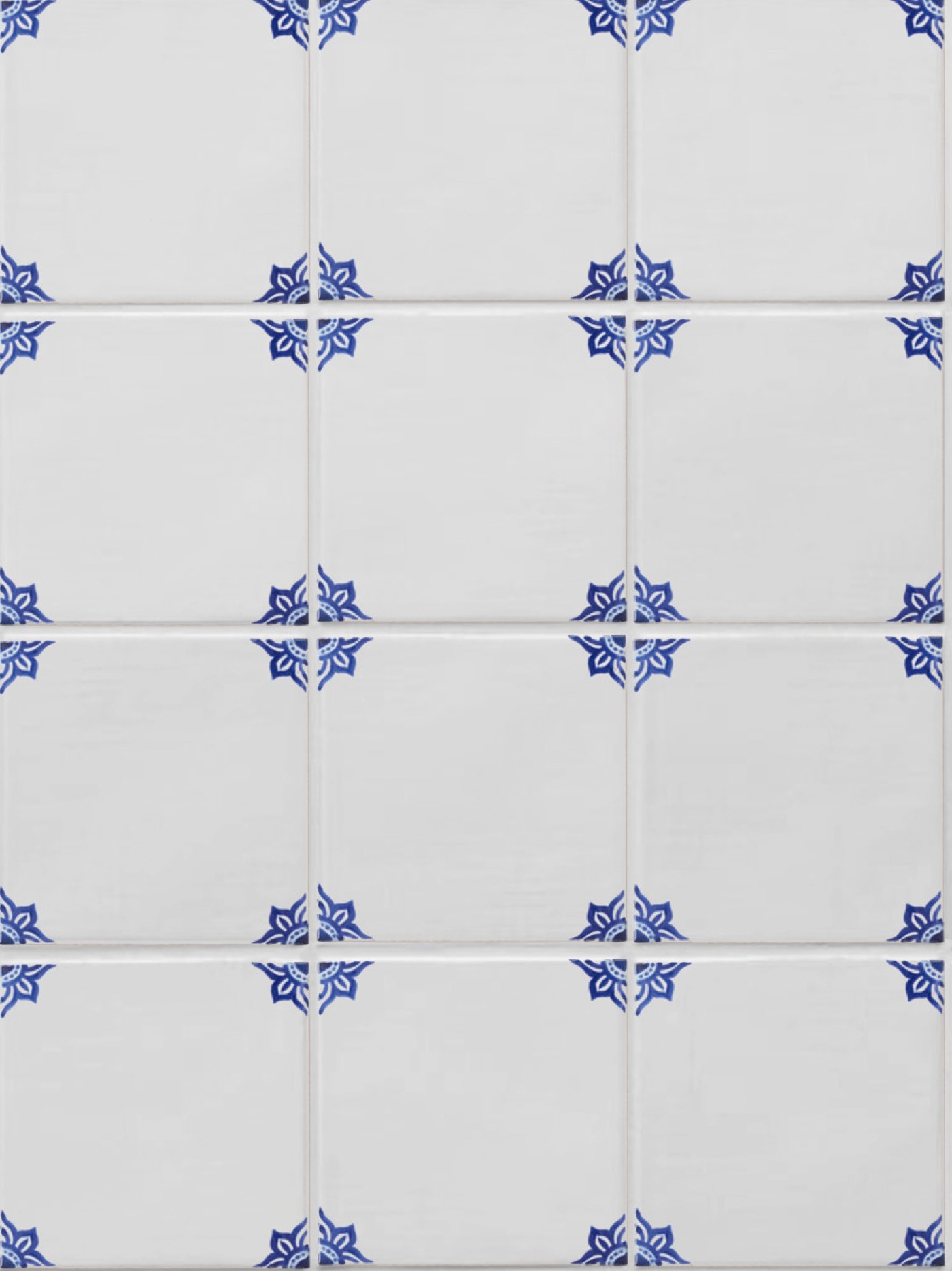 white tiles with hand painted blue designs.