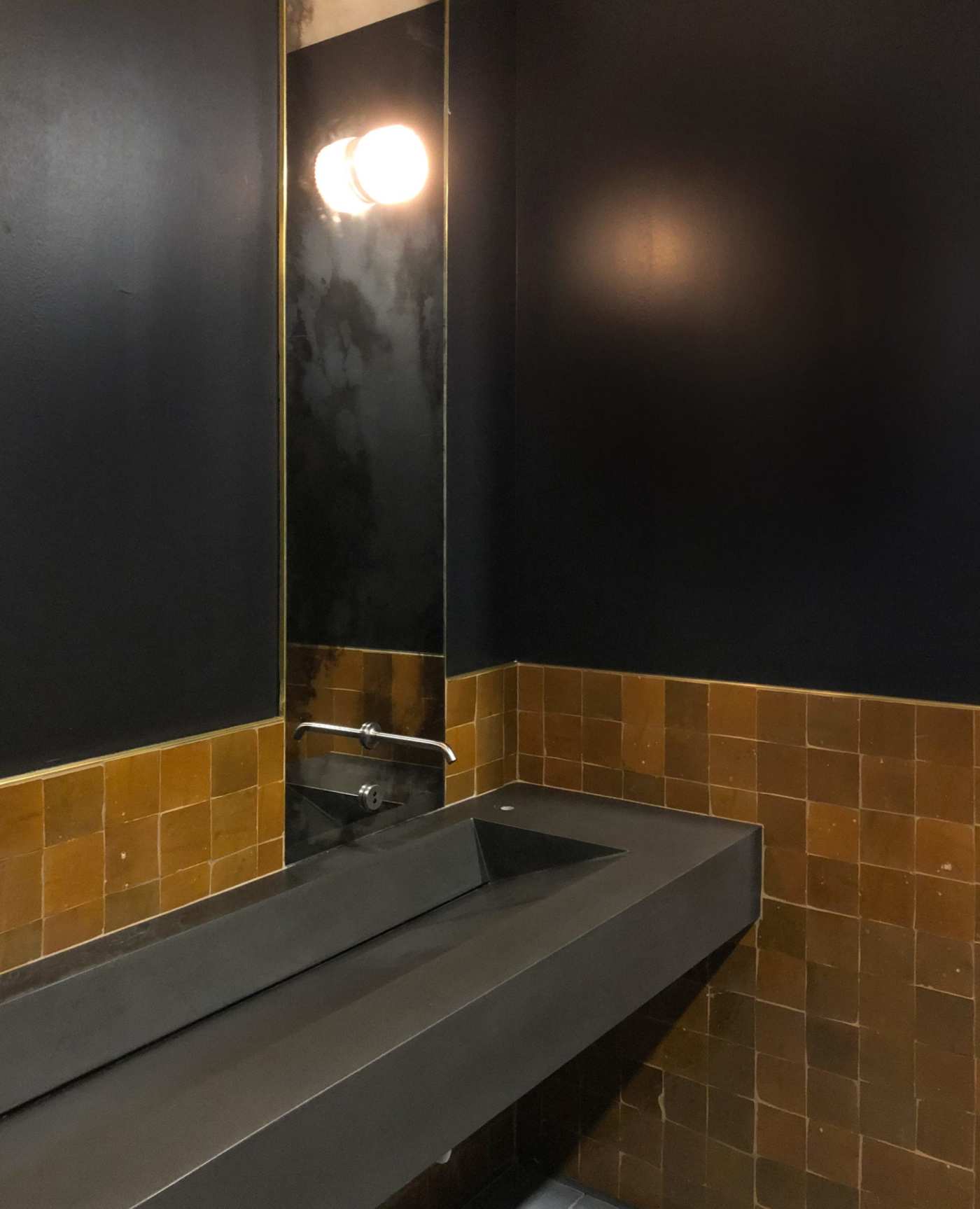 a bathroom with a sink and a mirror.