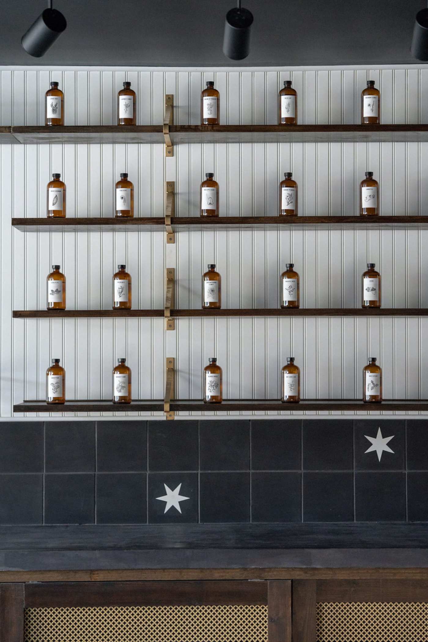 a wall of shelves with bottles on them.