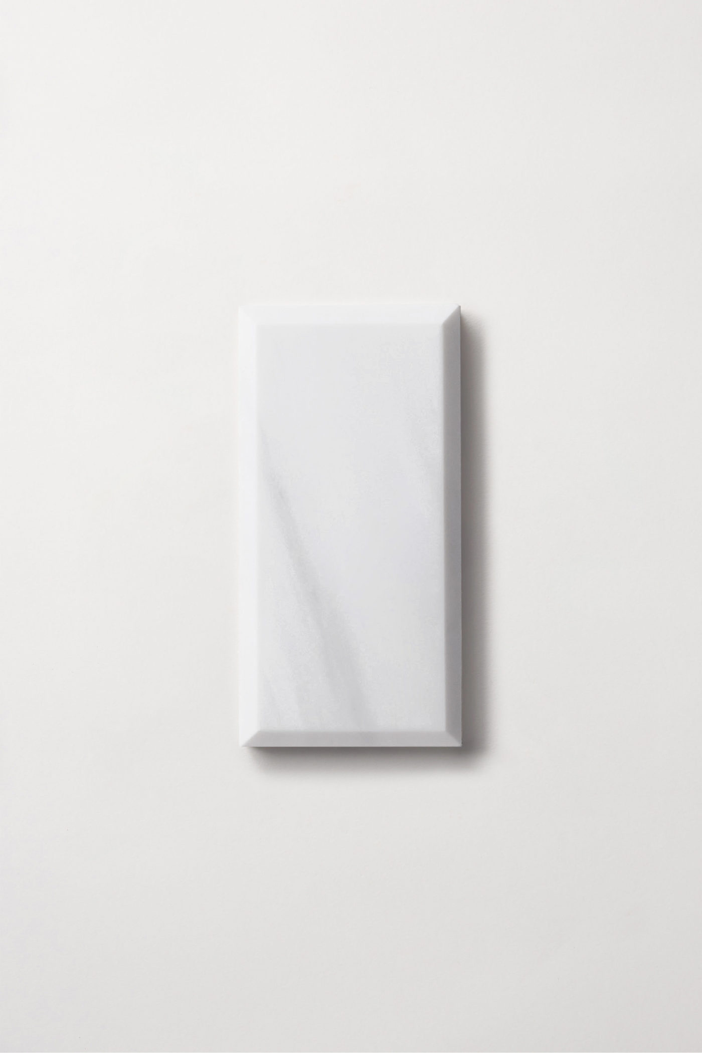 a white rectangle tile on a white background.