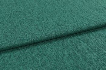 Teal-green textured upholstery fabric, close-up, showing short nap and subtle ribbing; folded horizontally with a visible overlap; photographed under soft, even lighting against an indistinct neutral background.
