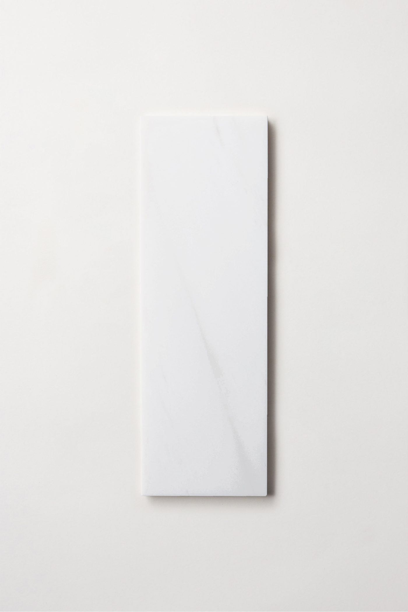 a white rectangle tile on a white background.