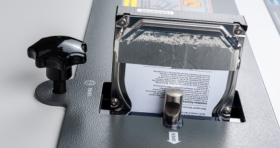 Hardened nickel punch renders hard drives completely unreadable.