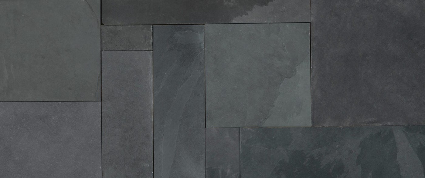 a close up view of a grey slate tile surface.