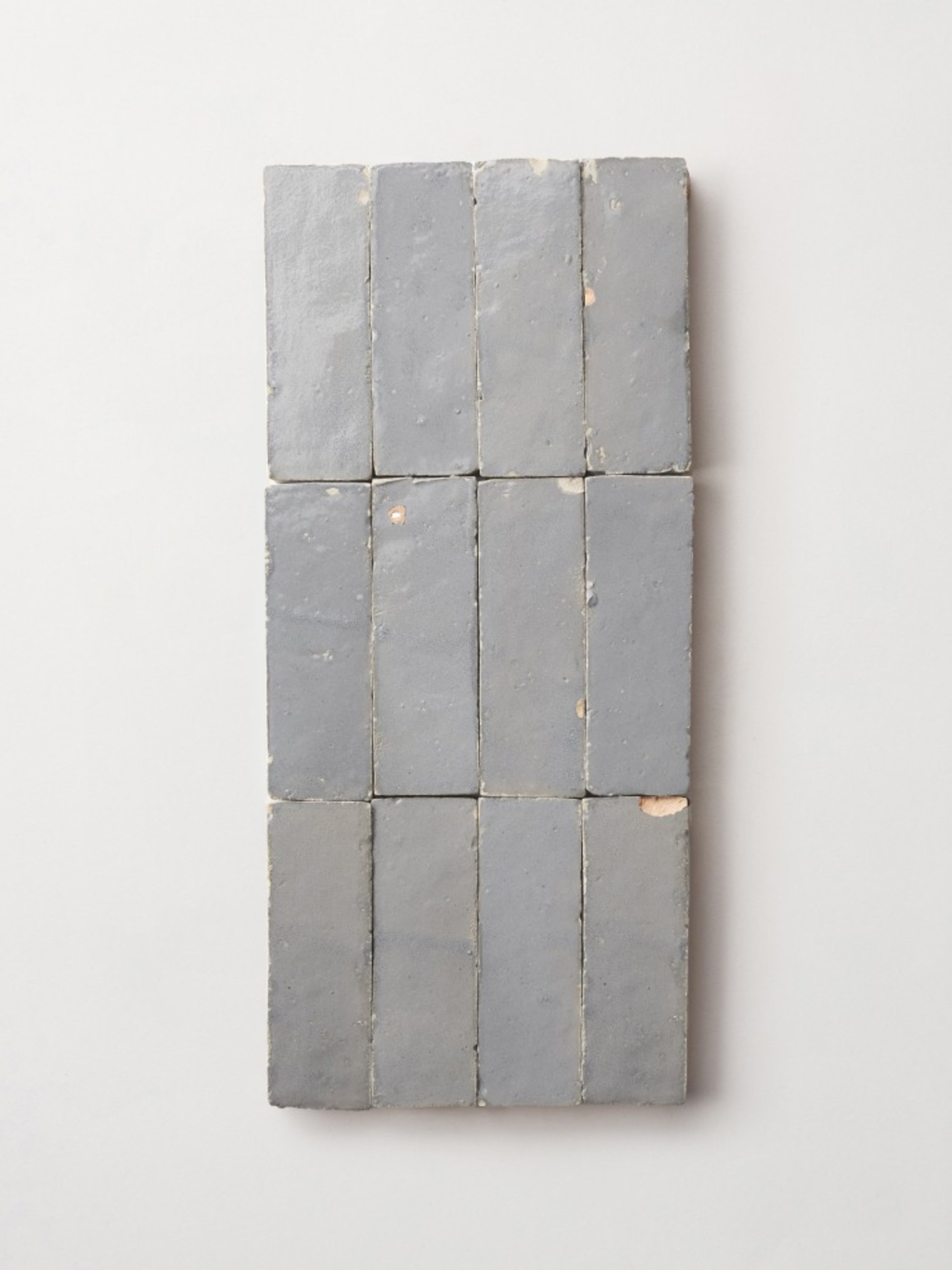 gray tiles on a white surface.