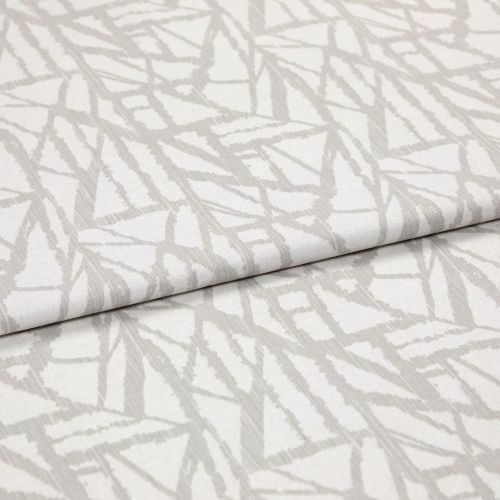 Neutral cream curtain fabric with pale grey abstract linear pattern, folded in overlapping layers; close-up studio view showing woven texture, soft even lighting and shallow depth of field.
