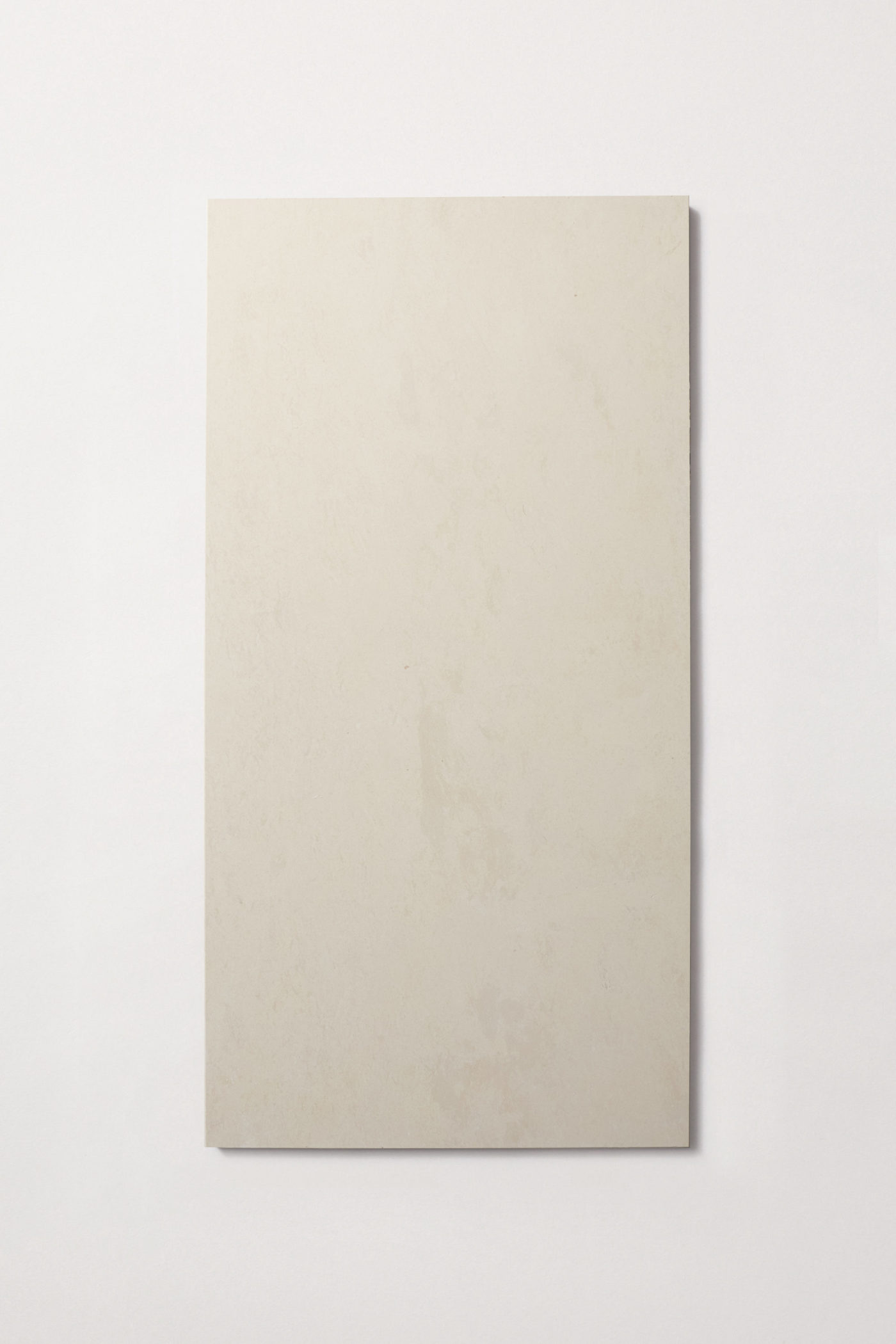 a rectangle shaped cream colored limestone tile.