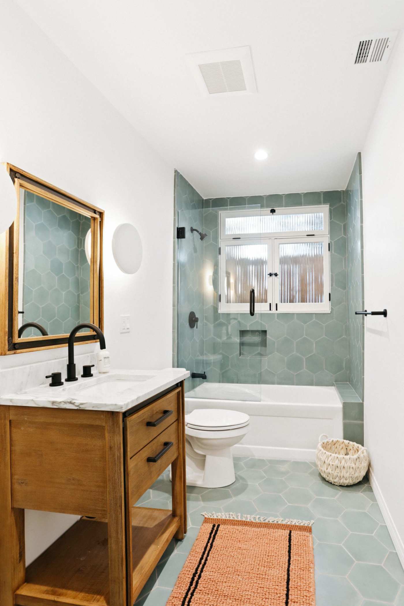 a bathroom with tile floors and a sink.