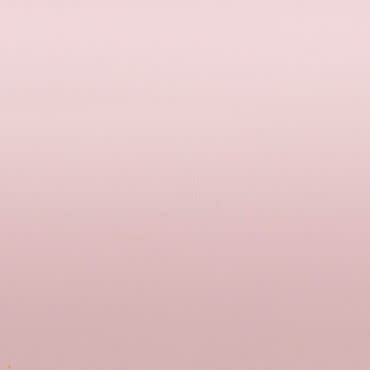 Plain pale pink wall, smooth with slight texture and faint scuffs, filling the frame; unadorned and evenly lit, suggesting an empty room or backdrop with soft, diffuse lighting.