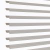 Zebra-style roller blinds, horizontal alternating sheer and opaque taupe stripes across a vertical window, aligned and partly open, filtering soft daylight against a bright white background in a close-up shot.