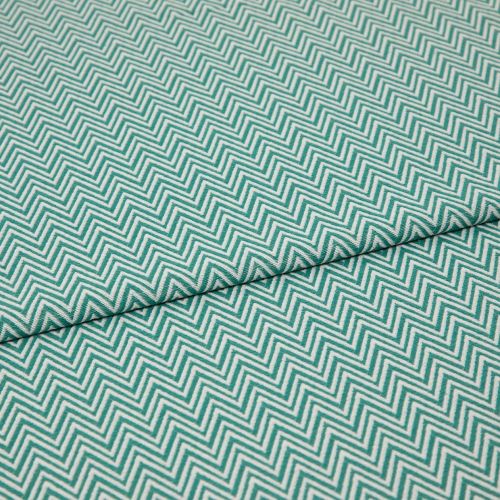 Folded teal-and-white chevron fabric (zigzag pattern) â€” folded once forming a horizontal seam â€” close-up, evenly lit textile filling the frame, showing texture and repeating geometric pattern.