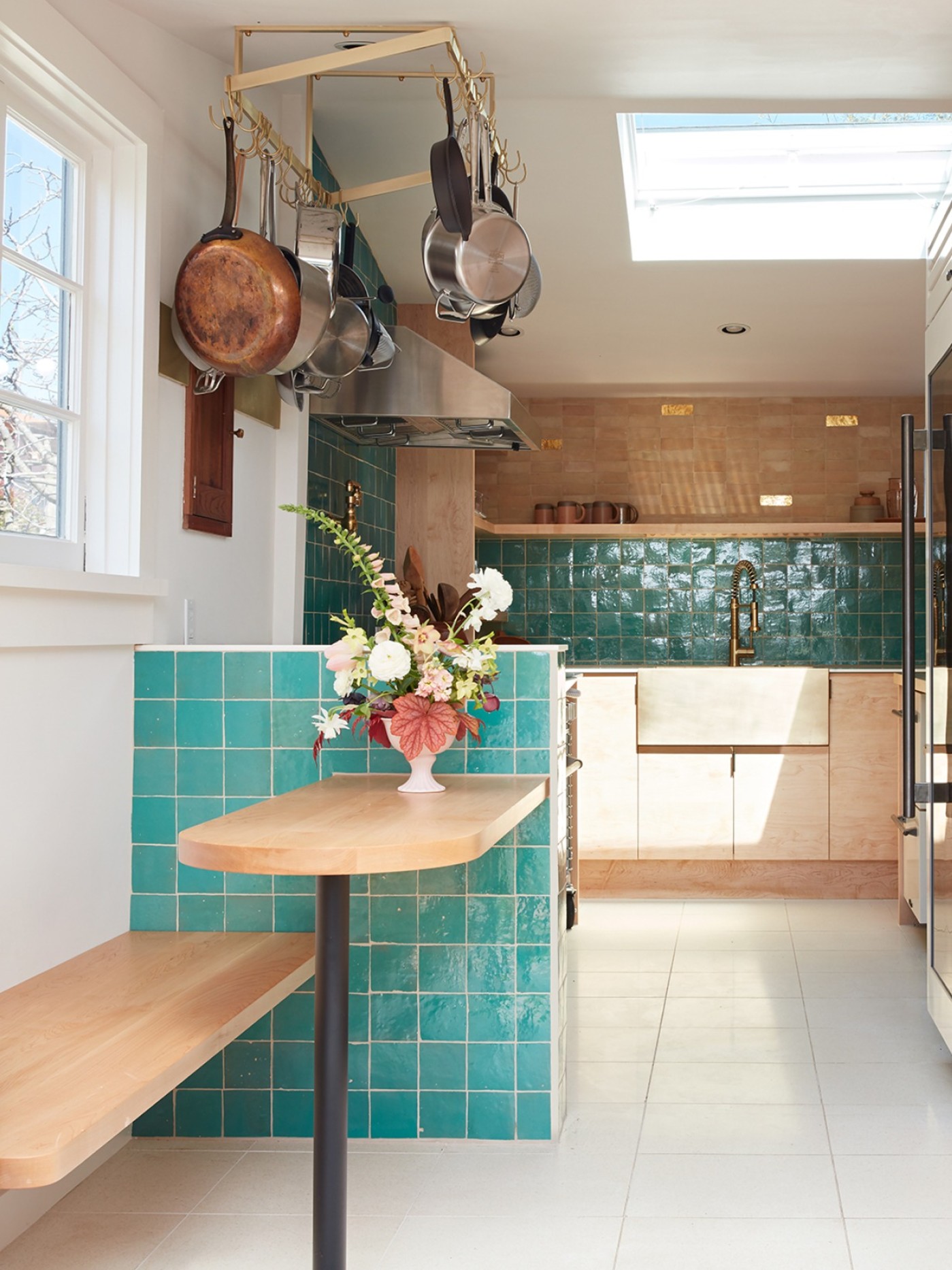 a kitchen with blue tiled walls.