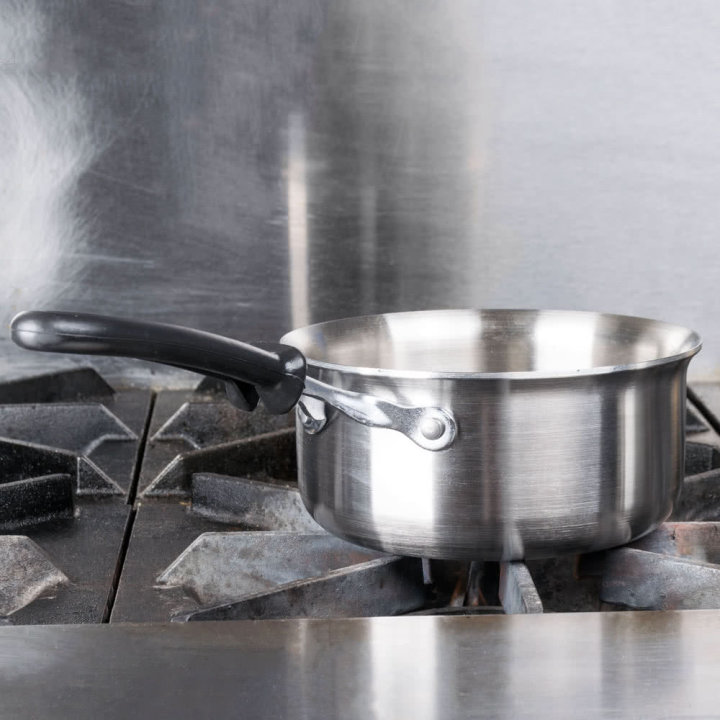 1 ½-quart Tribute® 3-ply saucepan with silicone TriVent™ handle