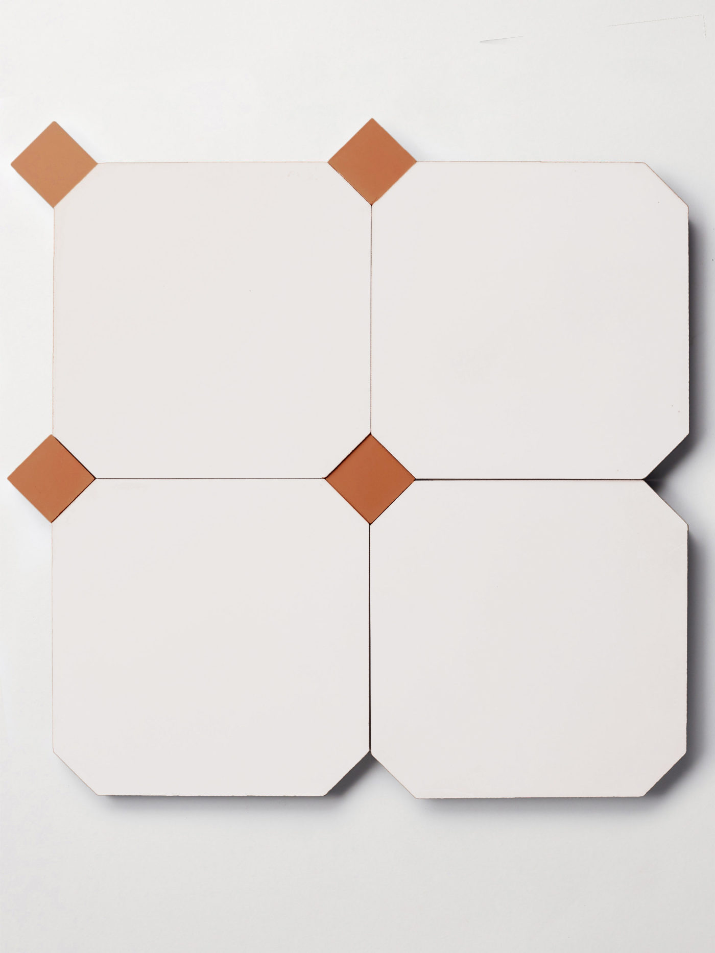 a set of white octagonal tiles and smaller red square tiles.