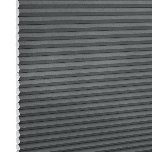 Gray cellular (honeycomb) blind, fully lowered with horizontal pleats and exposed honeycomb edges at left, blocking light; close-up studio view against a white background.