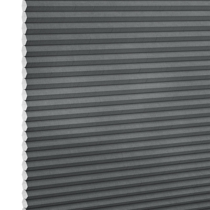 Gray cellular (honeycomb) blind, fully lowered with horizontal pleats and exposed honeycomb edges at left, blocking light; close-up studio view against a white background.