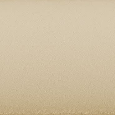 Textured beige plaster wall fills the frame, showing fine granular surface and a faint horizontal border at the bottom; uniformly lit, neutral close-up with soft, diffuse interior lighting.