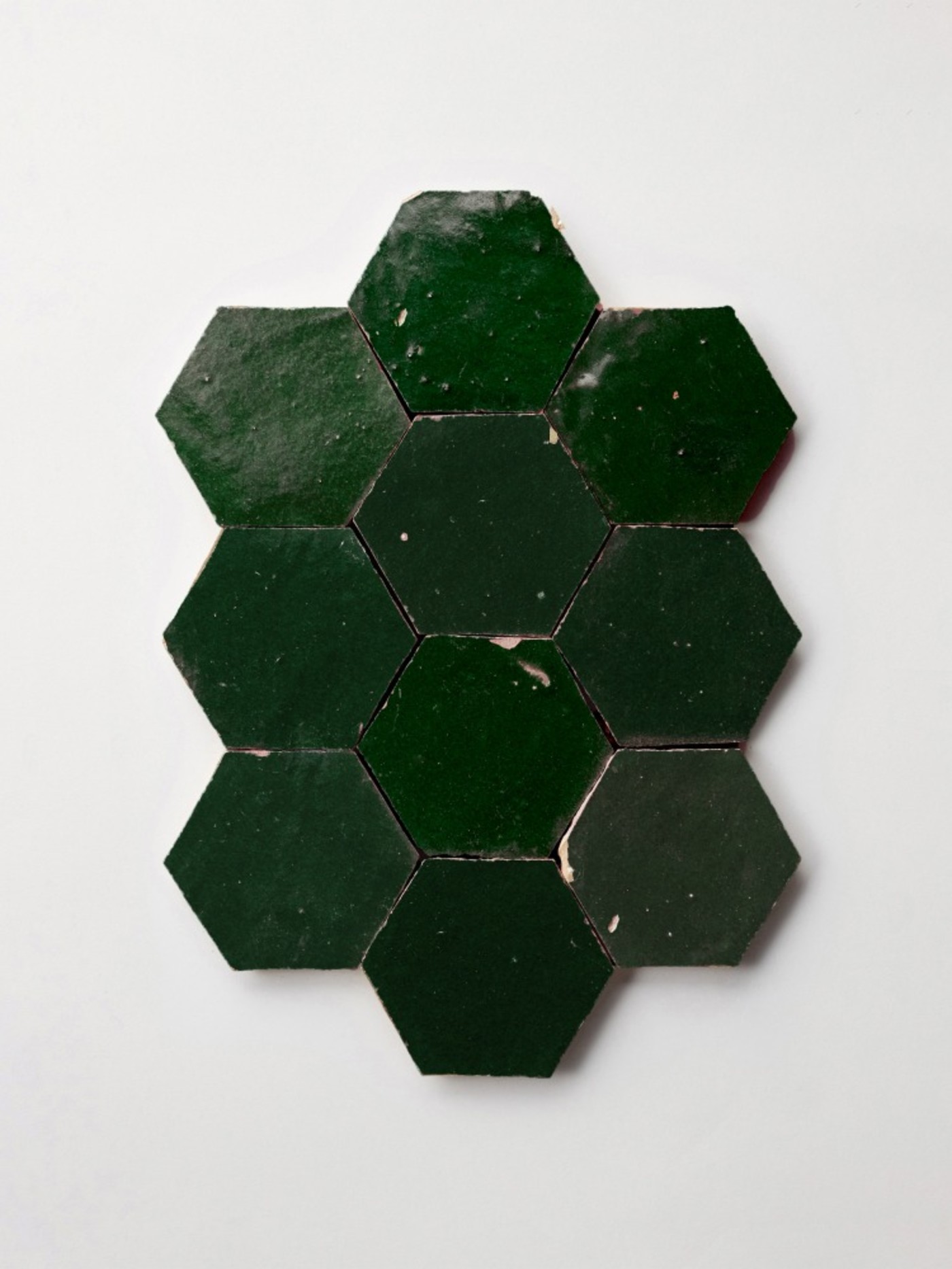 green hexagon tiles on a white background.