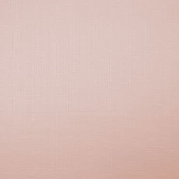 Textured rose‑pink wallpaper with a faint woven crosshatch pattern, lying flat and unornamented; it covers a wall surface, lit evenly by soft diffuse light with no other features visible.