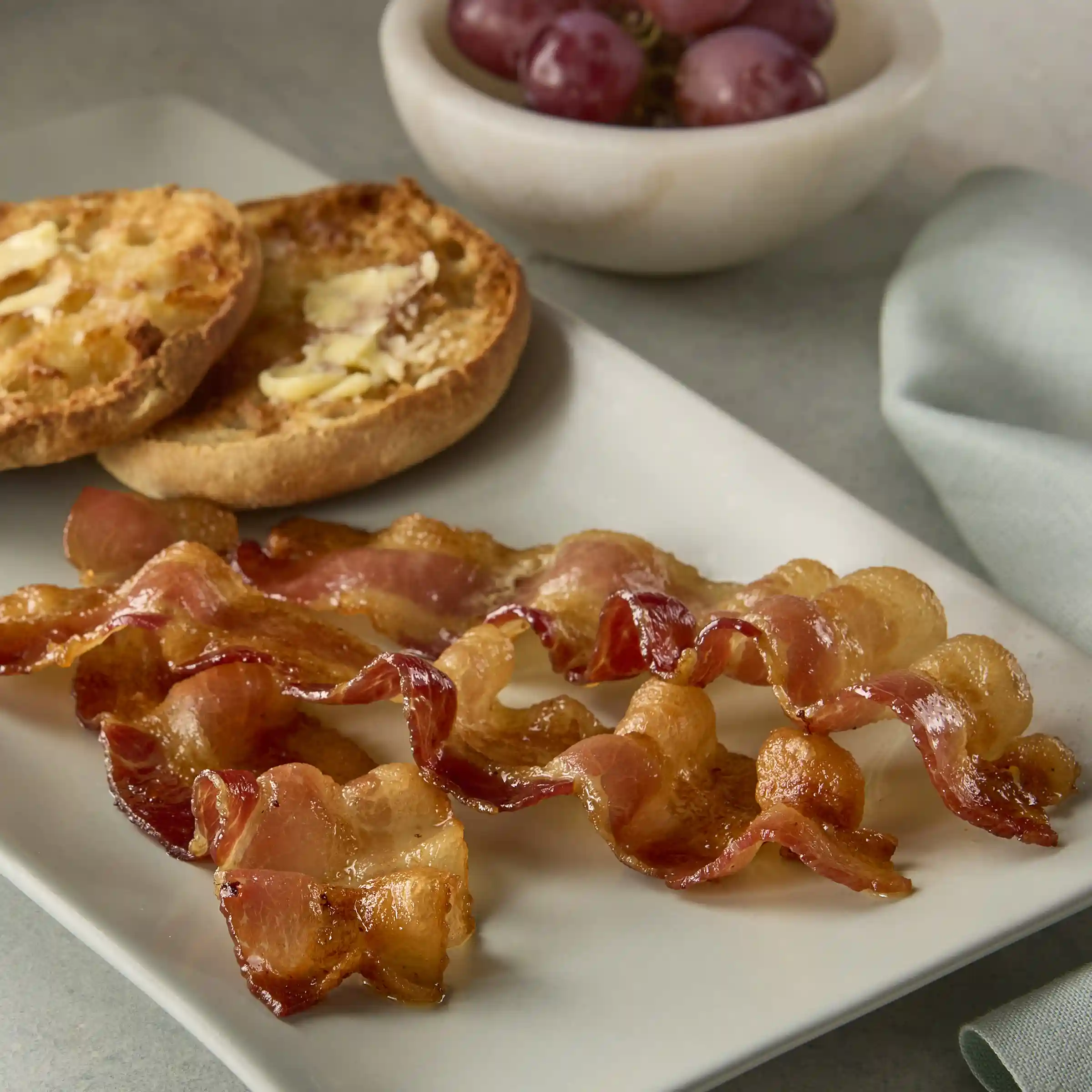Wright® Brand Naturally Applewood Smoked Thin Sliced Bacon, Flat-Pack® 18-22  https://images.salsify.com/image/upload/s--bz7TBvs7--/q_25/a5e8e81ac27b817f58e32f5fb9161c3af2528122.webp