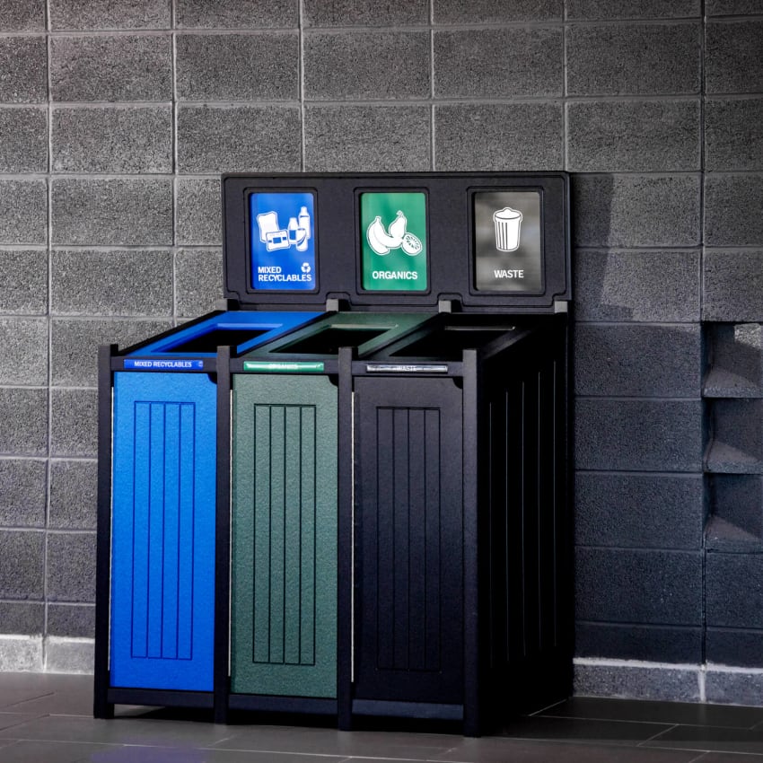 centralized recycling and waste container in a busy college campus hallway