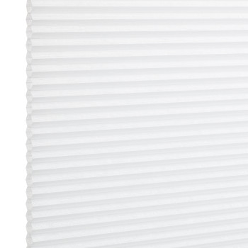 White pleated cellular window shade, fully lowered and closed with regular horizontal honeycomb cells; filtering diffuse light in a bright, minimal interior setting.