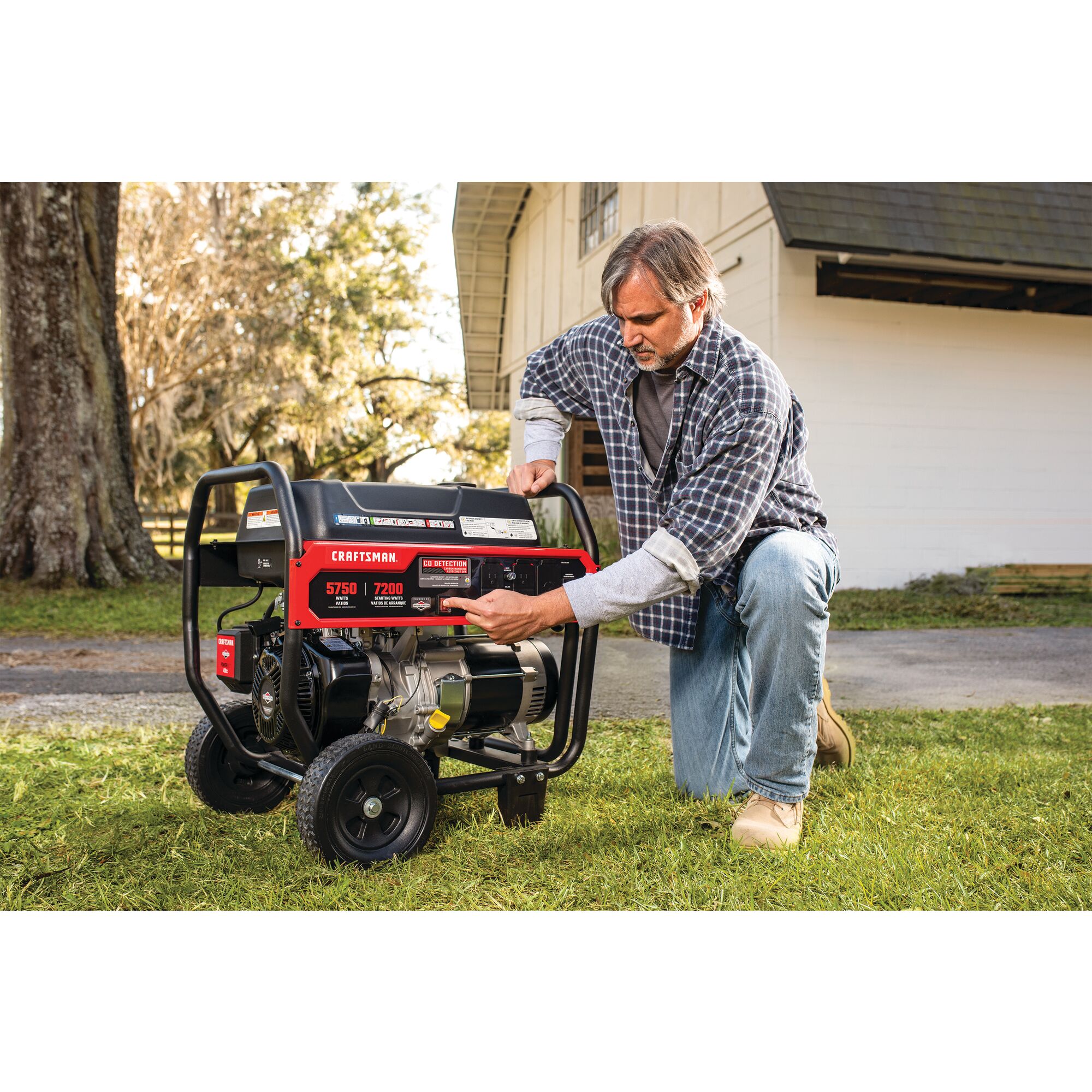 5750 watt portable generator being used by a person.