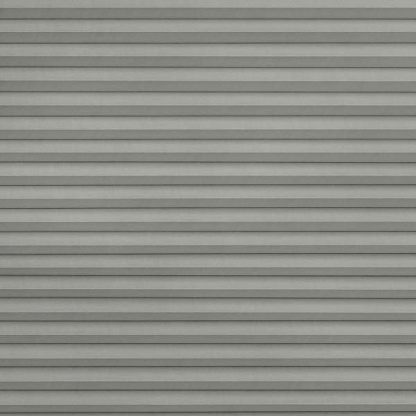 Gray horizontal pleated blinds, fully closed with overlapping slats, blocking light; occupying a window in a softly lit room, creating a uniform, layered shadow pattern.