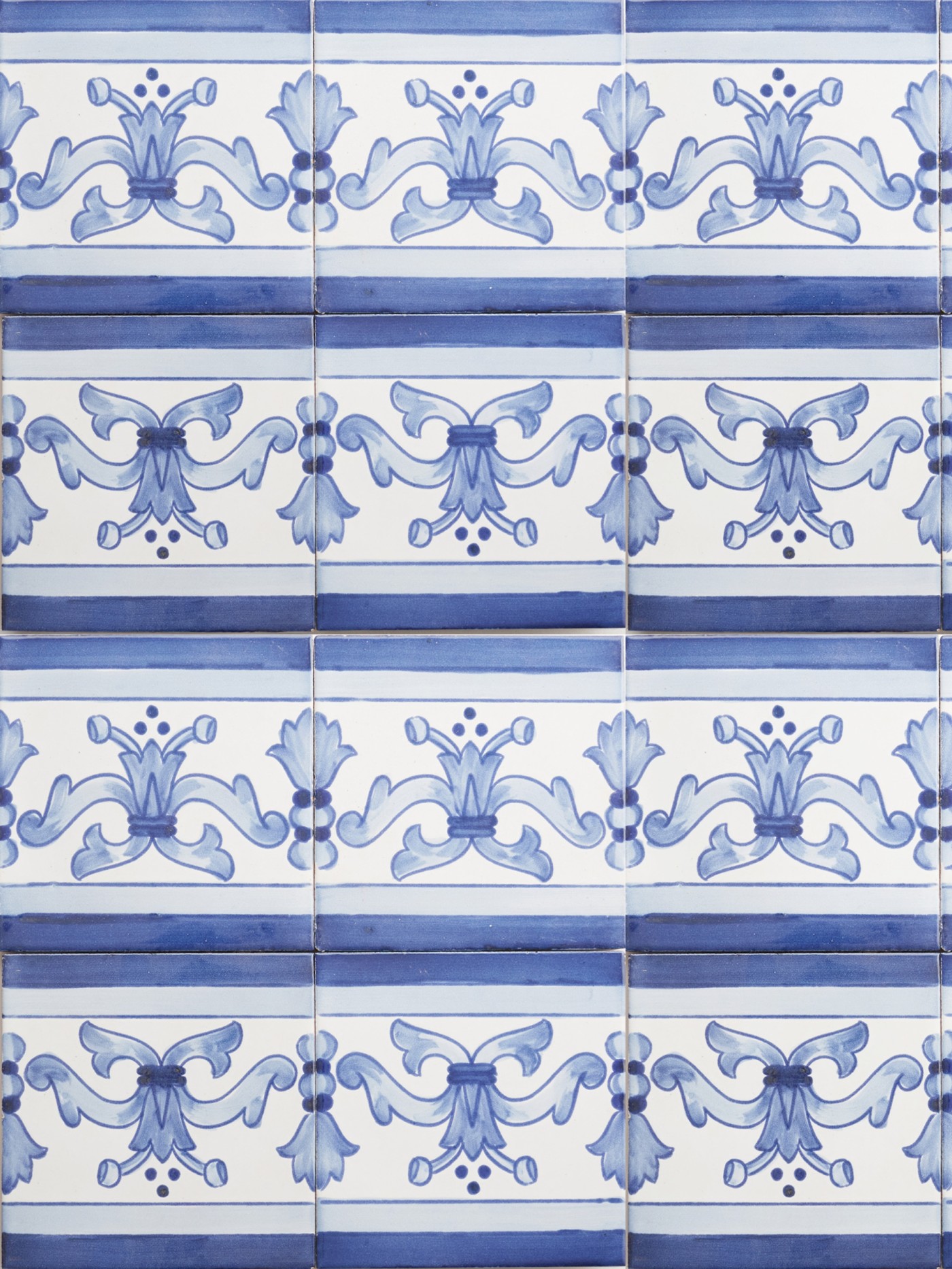 a set of blue and white tiles with hand painted floral designs.