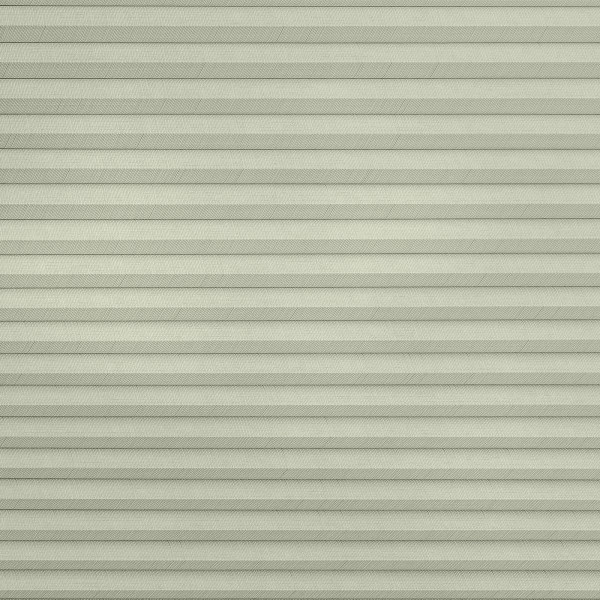 Pleated cellular window shade, fully lowered with uniform horizontal pleats and subtle herringbone fabric texture; closed to block view and softly diffuse daylight across a pale, neutral interior surface.