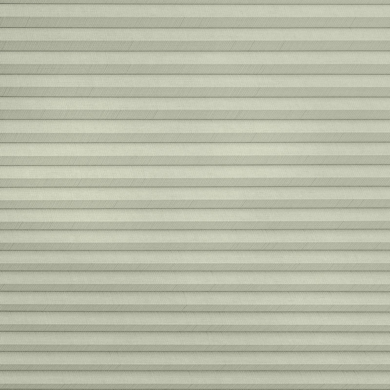 Pleated cellular window shade, fully lowered with uniform horizontal pleats and subtle herringbone fabric texture; closed to block view and softly diffuse daylight across a pale, neutral interior surface.