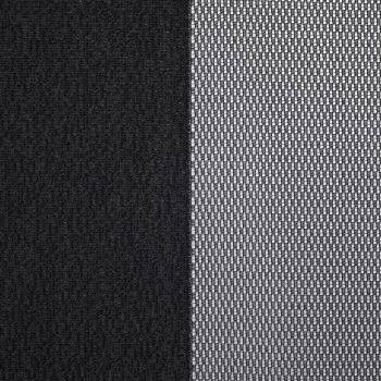 Two window dressings — a solid black blackout curtain (left) and a white woven sheer panel (right) — hang closed, the sheer filtering light; close-up interior view with neutral lighting.