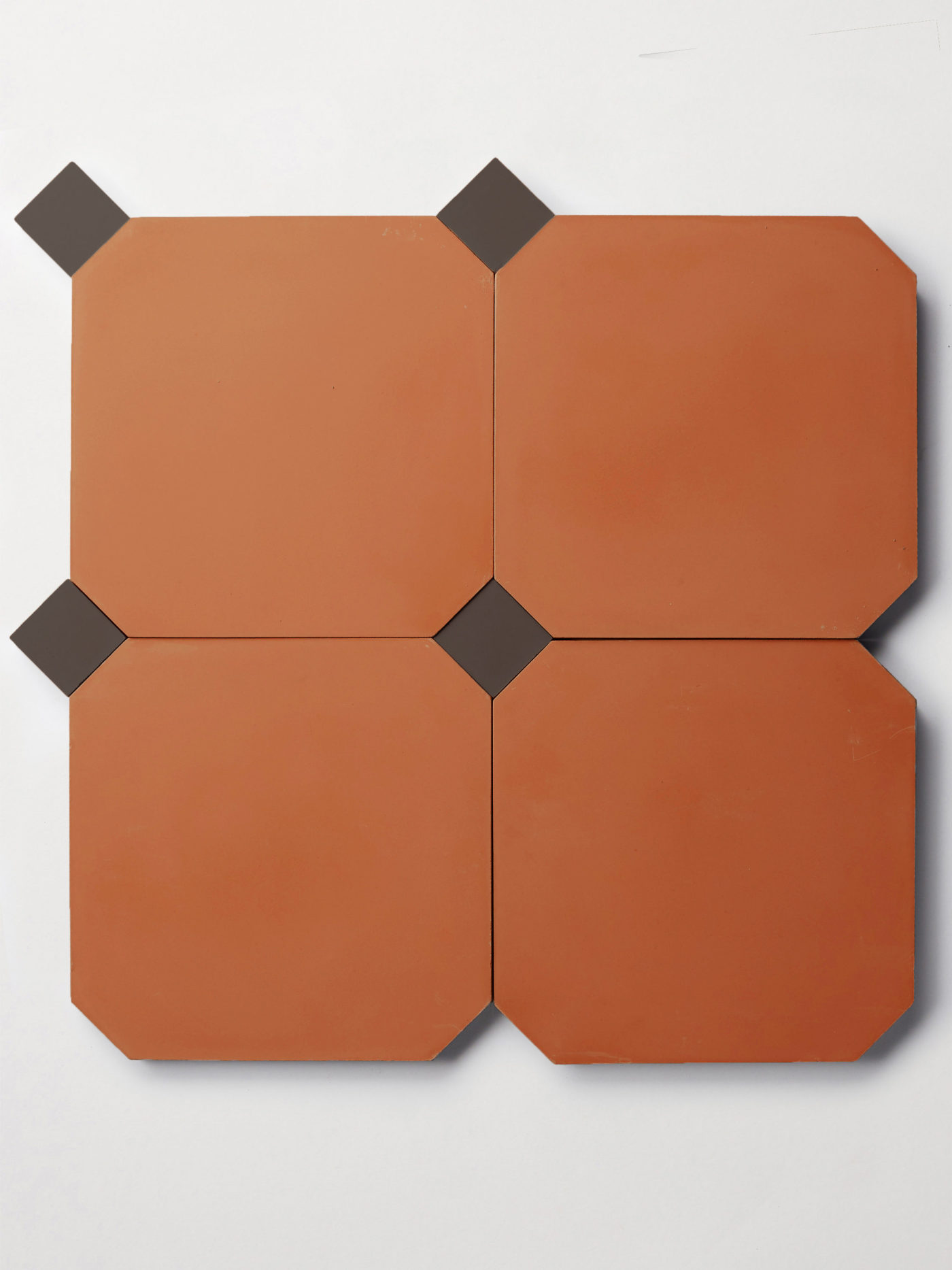 a set of four red tiles and four smaller black tiles on a white background.