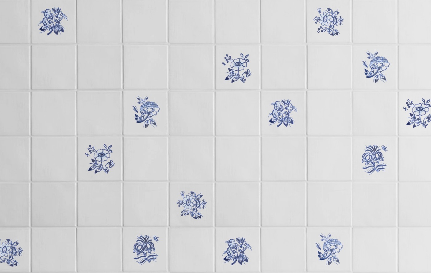 blue and white tiles with hand painted flowers on them.