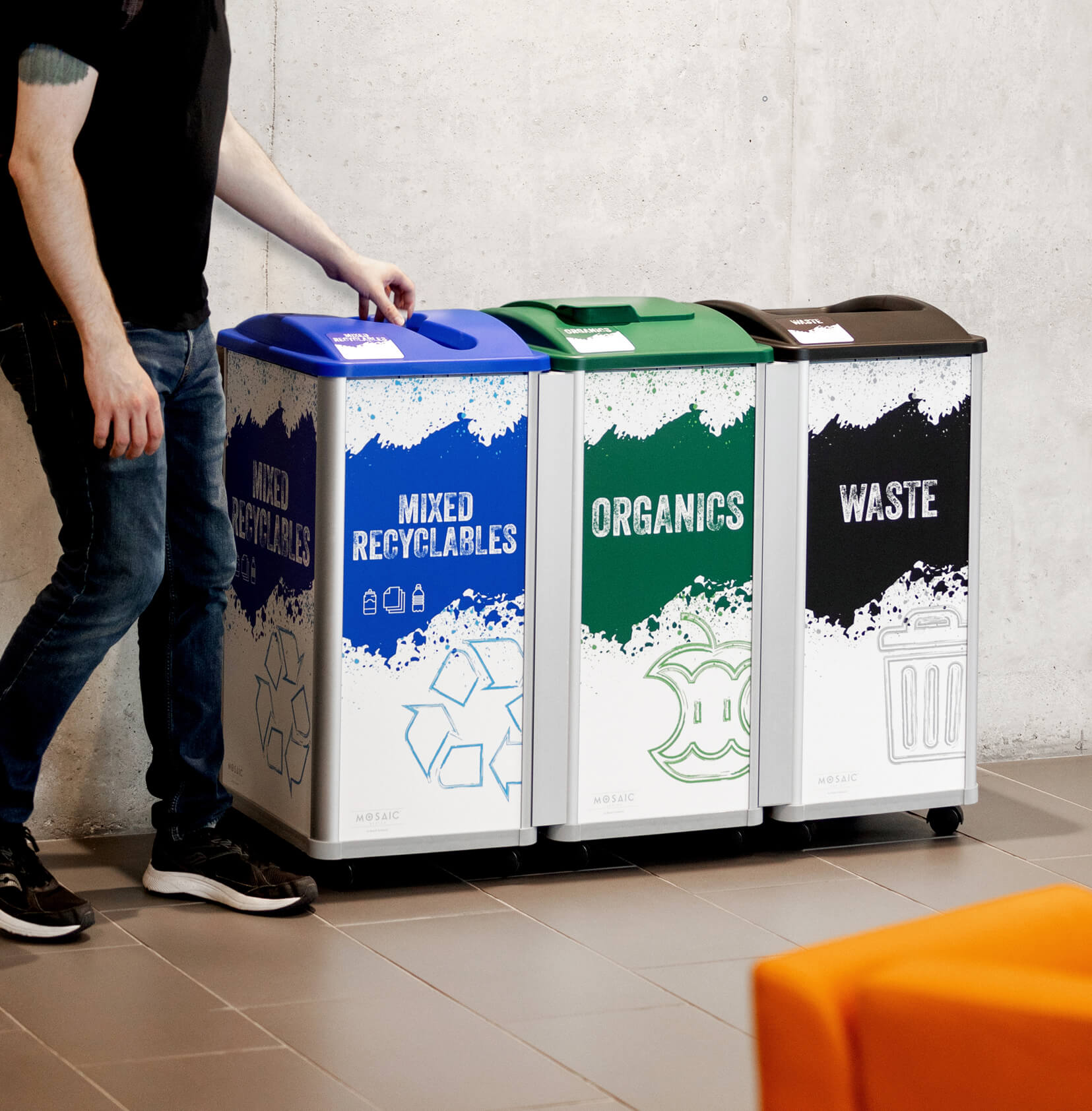 a waste and mixed recycling station at a university campus with modern signs showing waste collection information