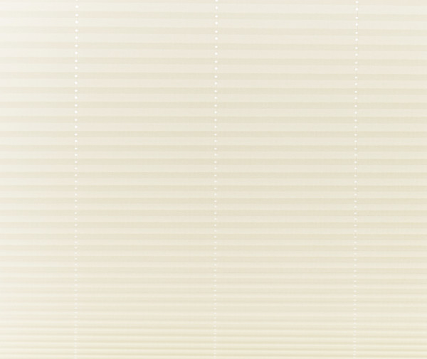 Beige pleated cellular shades covering a window, fully lowered and closed with vertical bead cords visible; filtering soft, diffused daylight into a neutral-toned interior, obscuring any outside view.