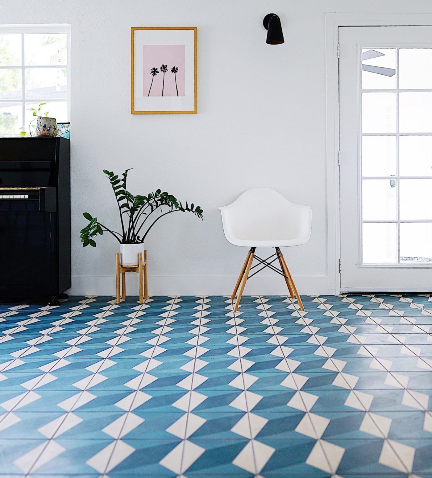 a blue and white tiled floor in a living room.