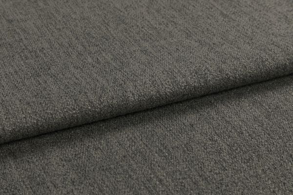 Gray textured upholstery fabric, folded over itself forming a horizontal overlap; revealing tight weave and slight nap; close-up view under soft, even lighting.