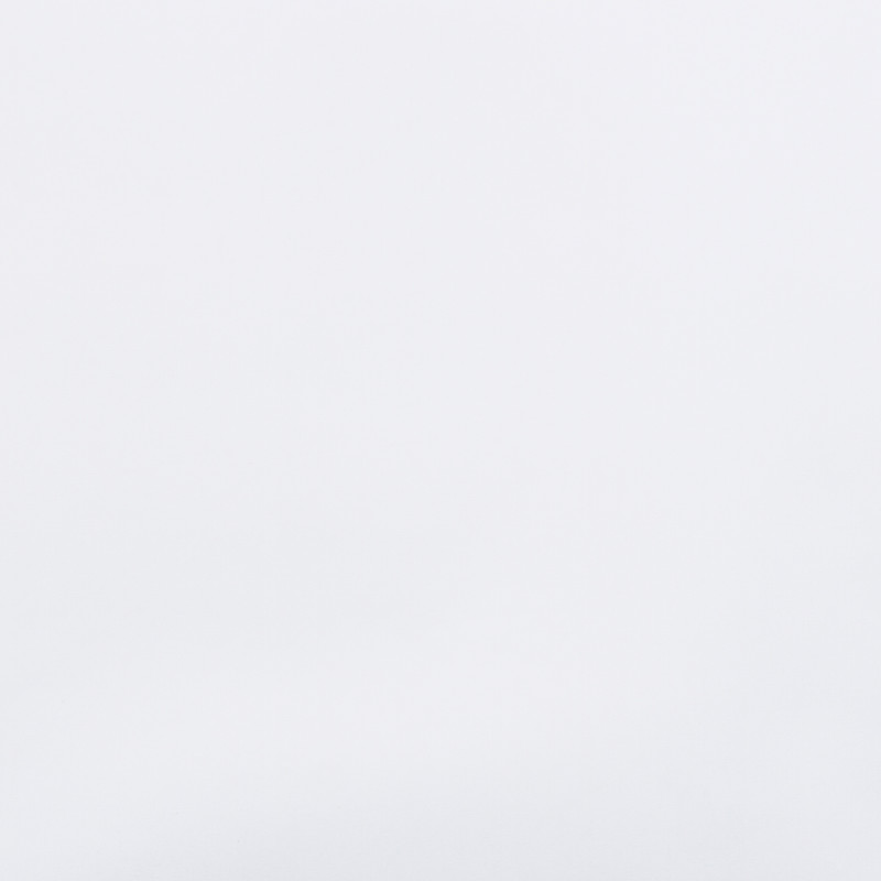 Unadorned white wall filling the frame, uniformly illuminated and featureless, creating a bright, minimal interior backdrop with soft, diffused lighting and no visible furniture or windows.